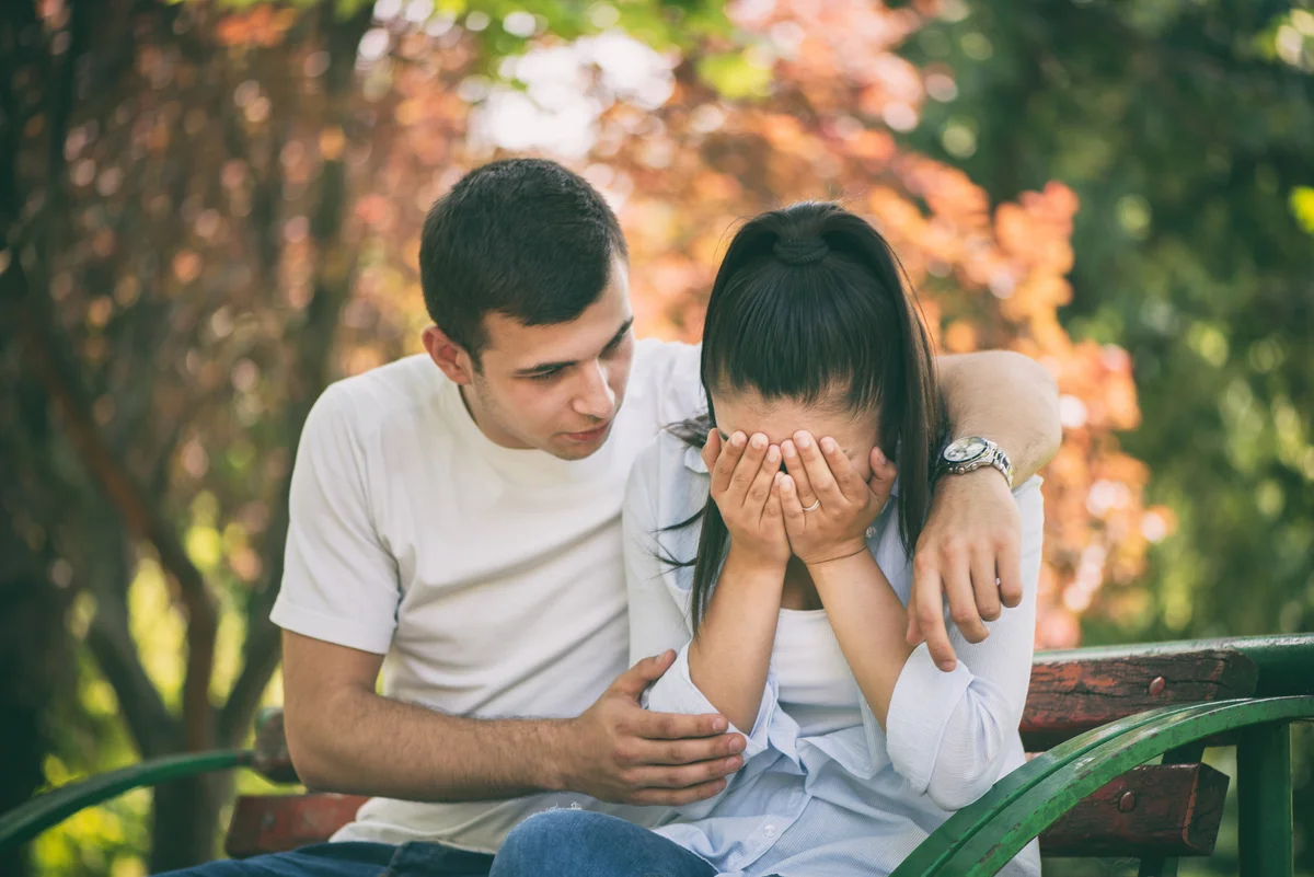 husband comforting grieving wife