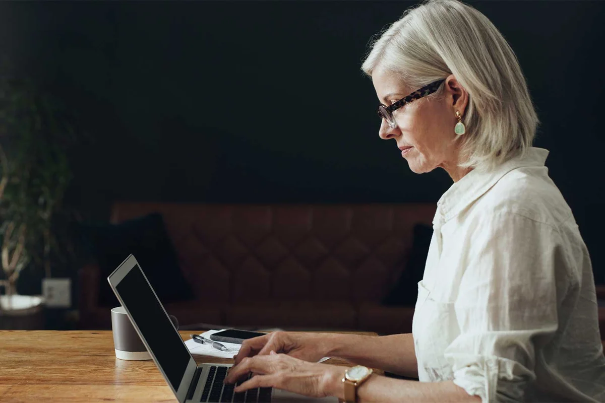 woman on computer researching social security death benefits