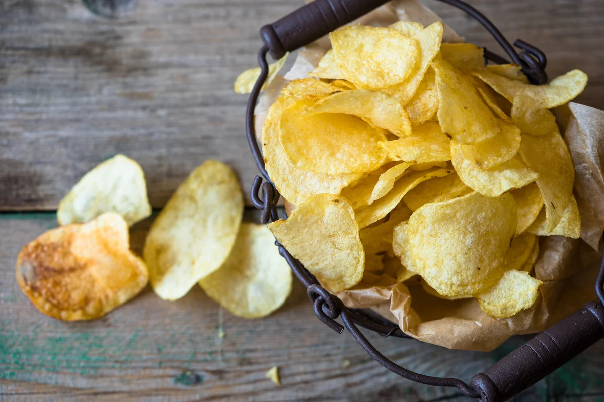 potato chips in rustic basket