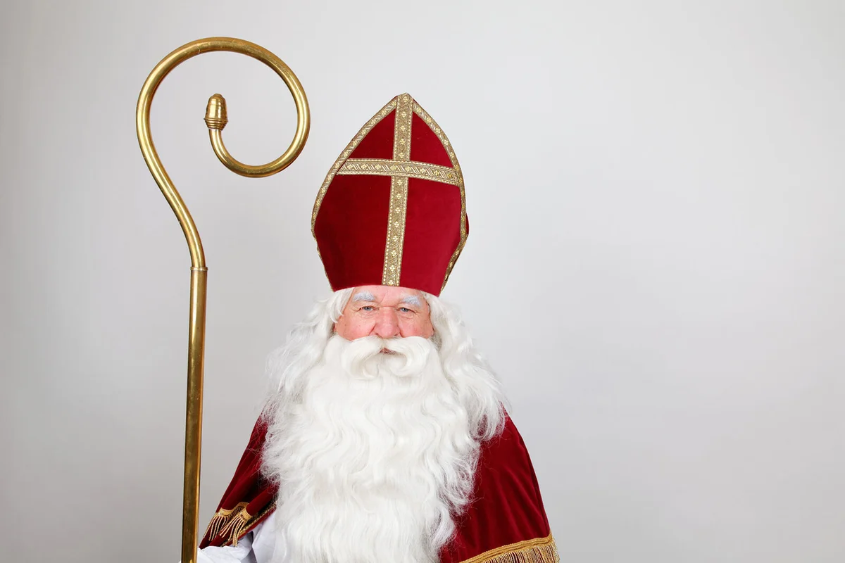 Saint Nicholas in red dress with mitre and staff