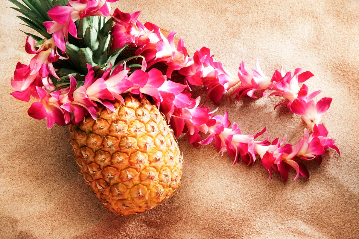 lei on pineapple at the beach