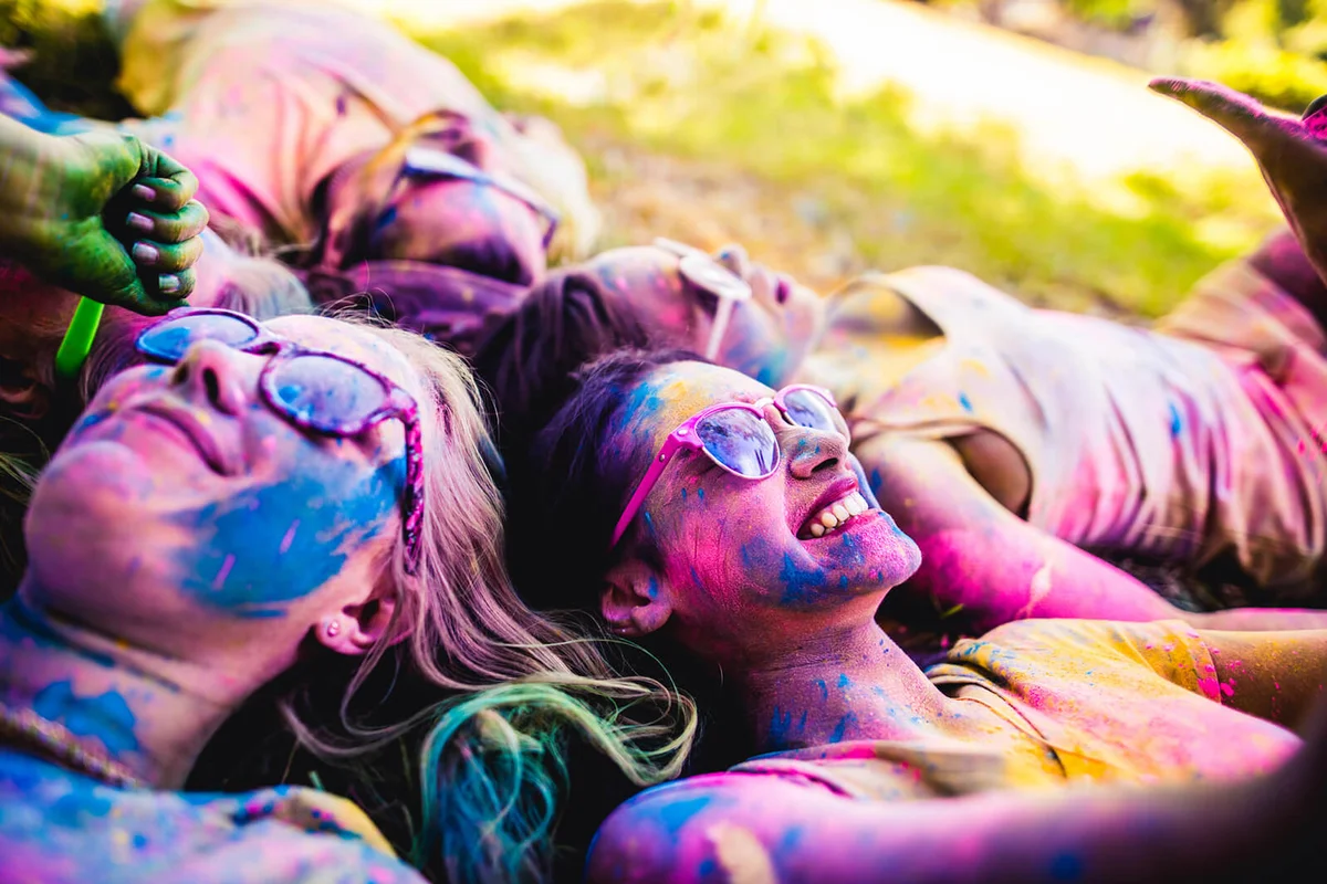 Group Covered in Holi Powder in Park