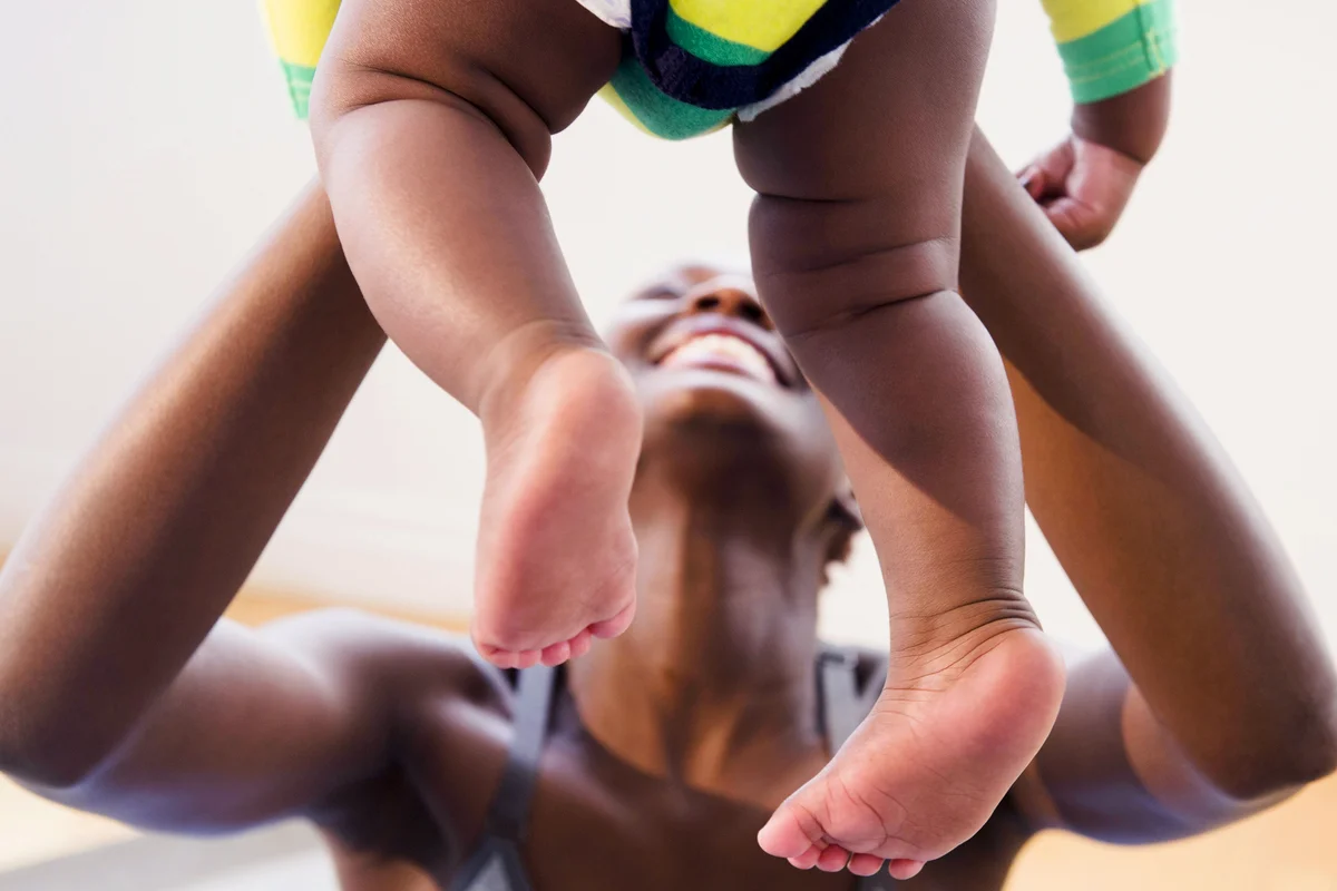 Mother playing with baby boy