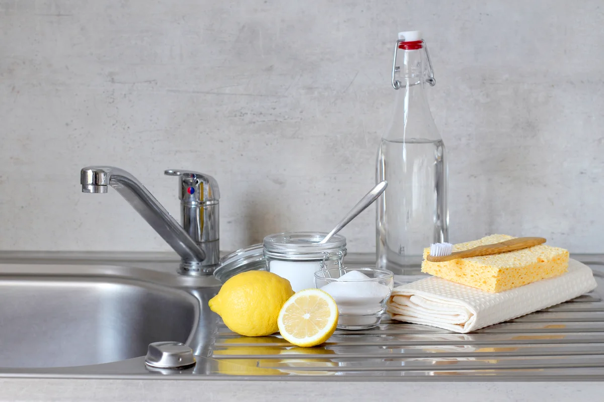 Vinegar, lemon and baking soda in kitchen
