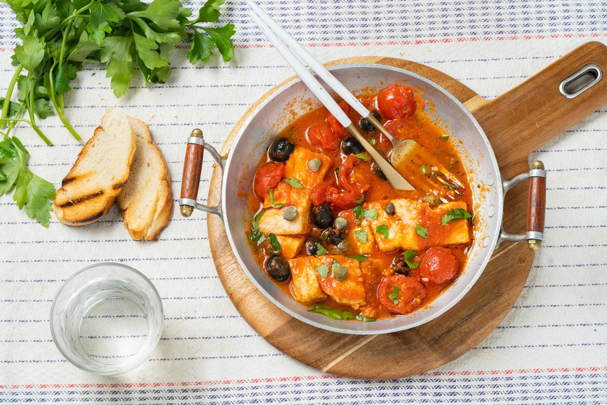 Cod fish in tomato sauce and olives