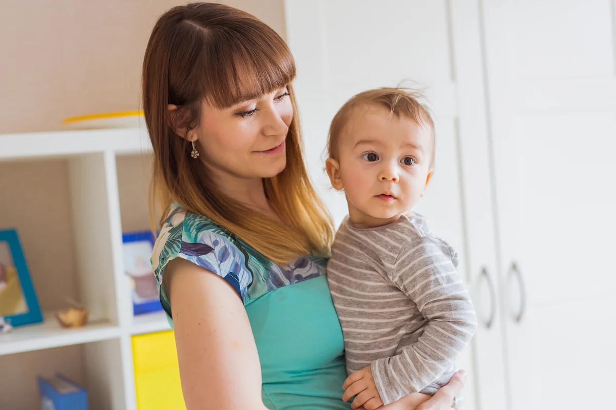 Au Pair holding baby