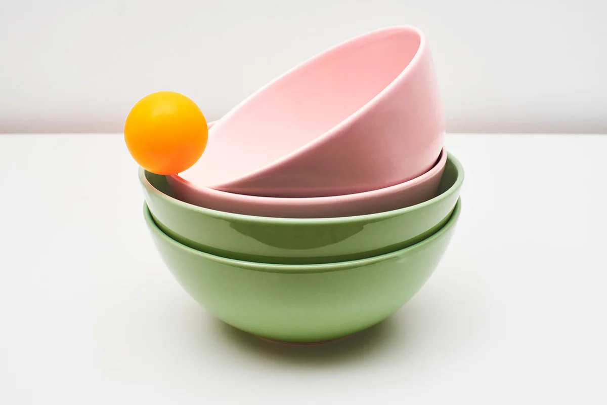 Pink and green earthenware and porcelain bowls