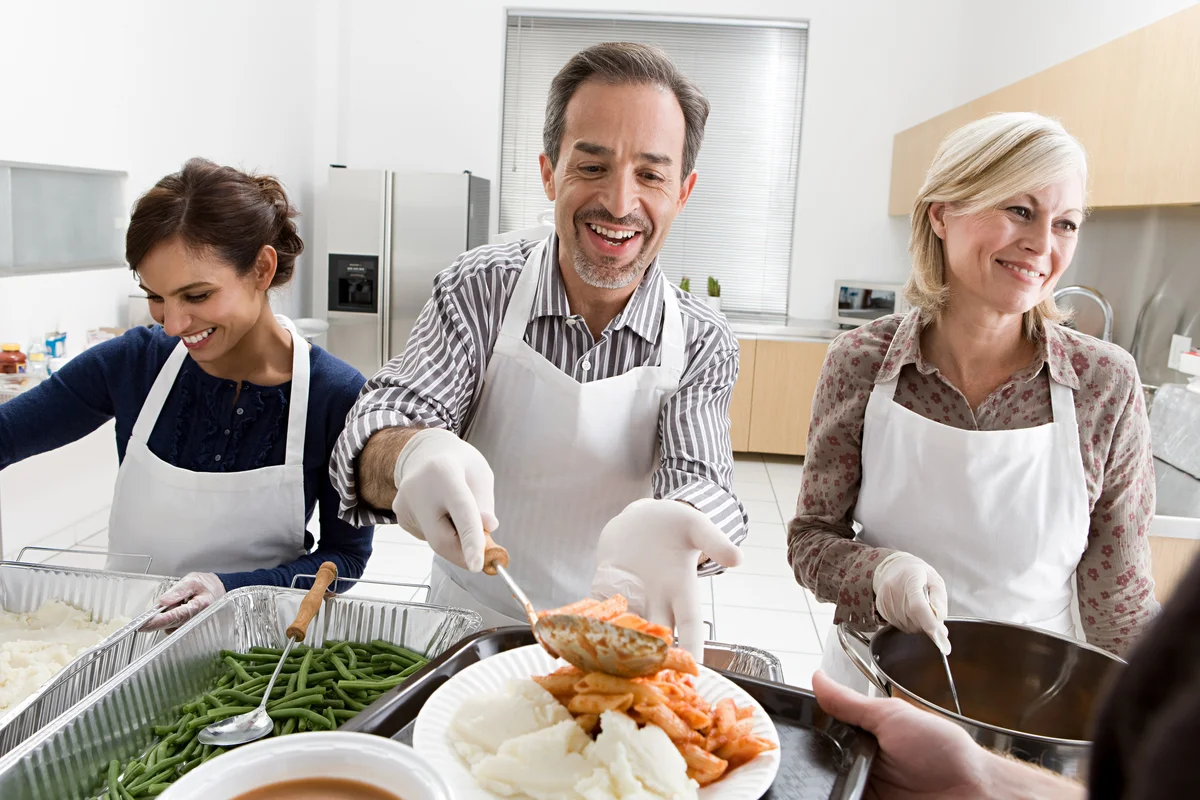 volunteers serving food