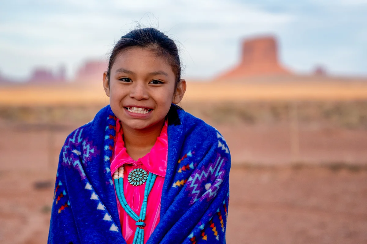 Pretty Nine Year Old Native American Navajo Indian Girl In the Early Morning Hours Dressed in Traditional Clothing