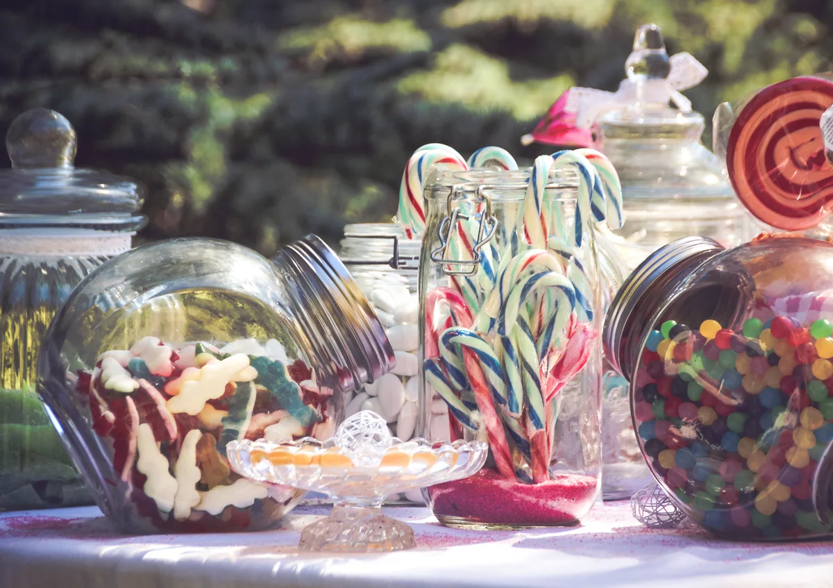 Jars full of candy on party table