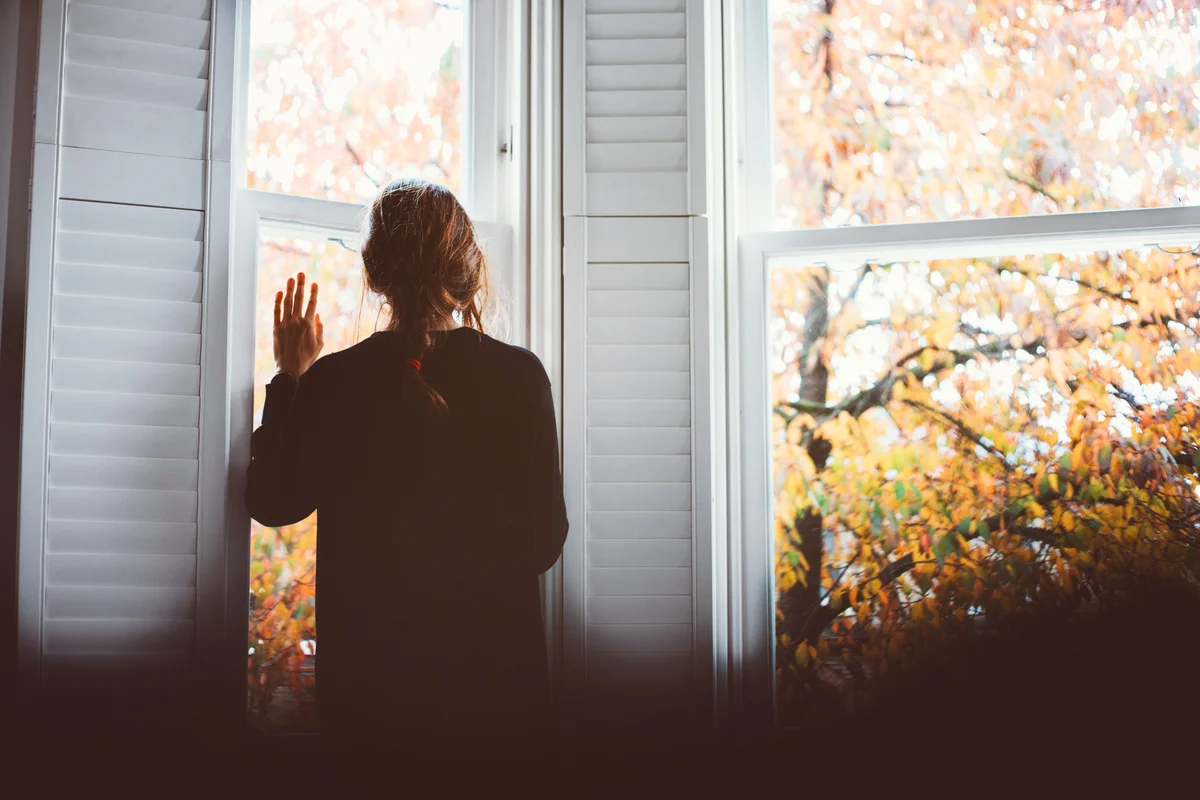Sad woman looking out the window