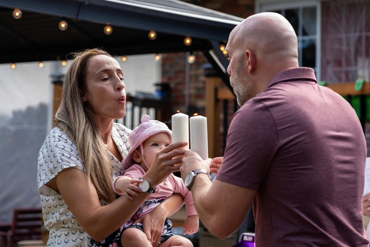 godparents celebrating with godchild