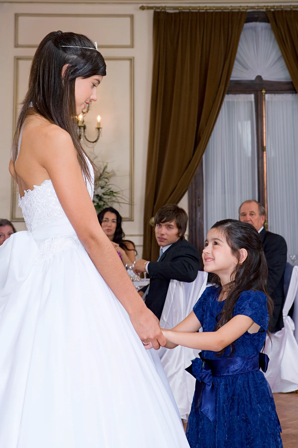 Girl and little sister at quinceanera