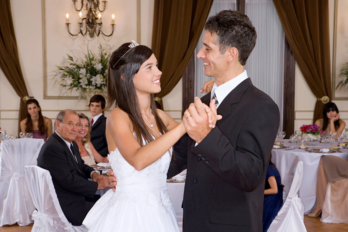 Father and daughter dancing at quinceañera