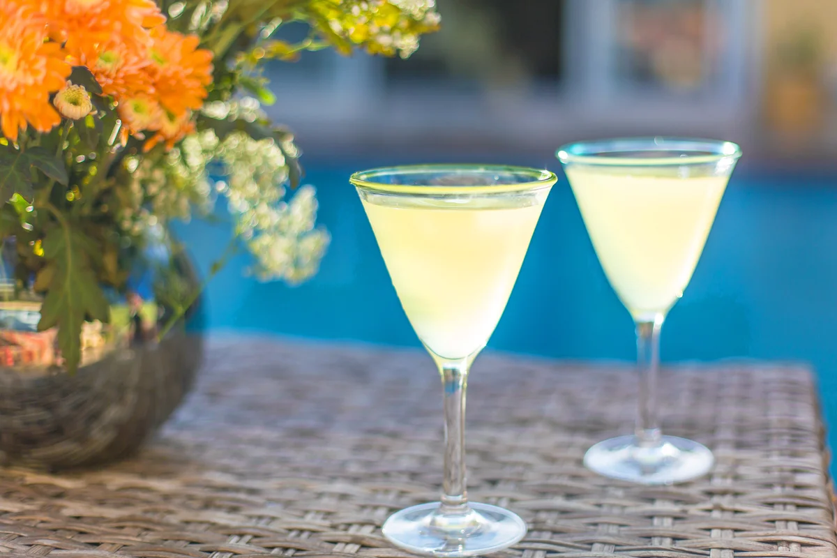 Two french 77 cocktails by the pool