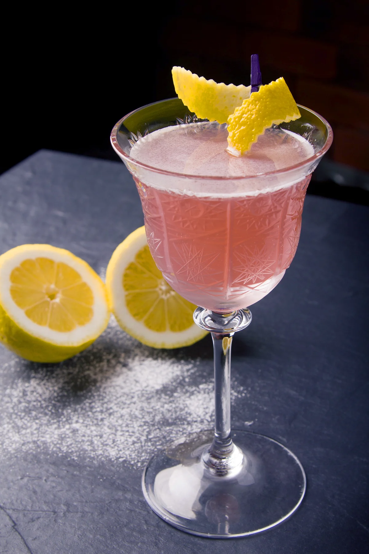 Pink 75 cocktail on table