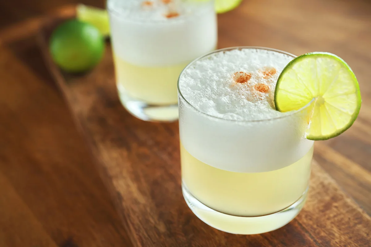 Pisco Sour Cocktail served with Lime