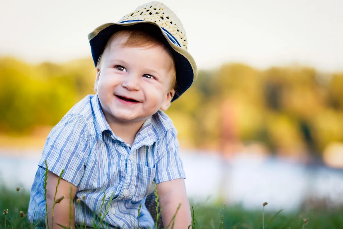 southern baby boy wearing seersucker shirt and straw hat