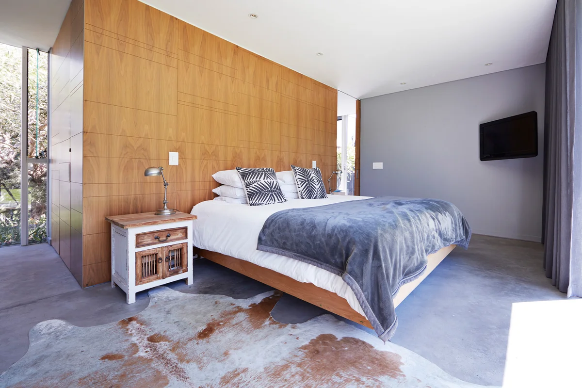 Modern bedroom interior with TV screen