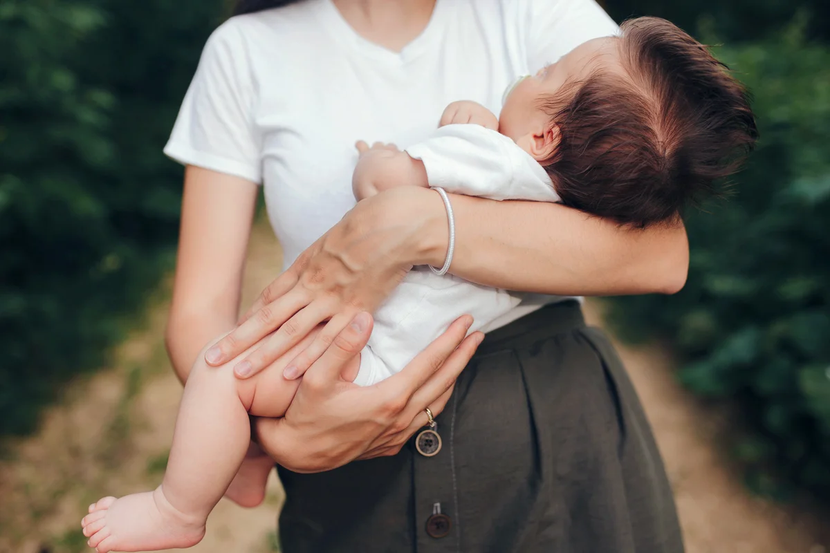 Mother Carrying Baby