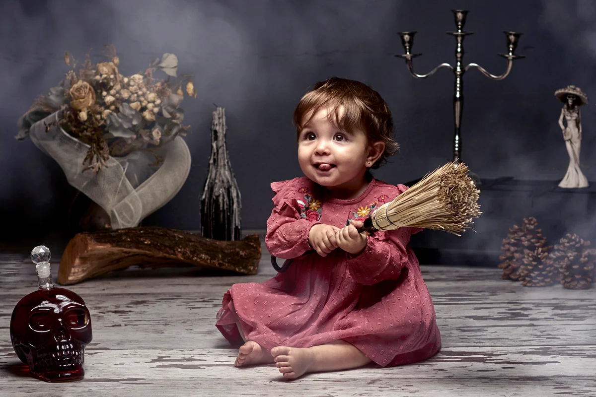 Little 10 month old witch dressed up for halloween