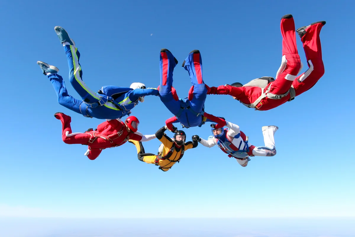 Group of men skydiving