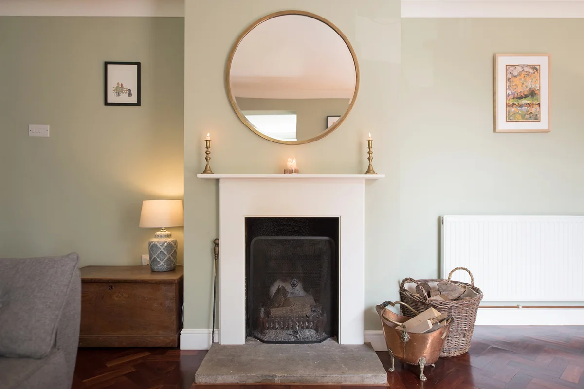 Mirror over fireplace in a moderm living room