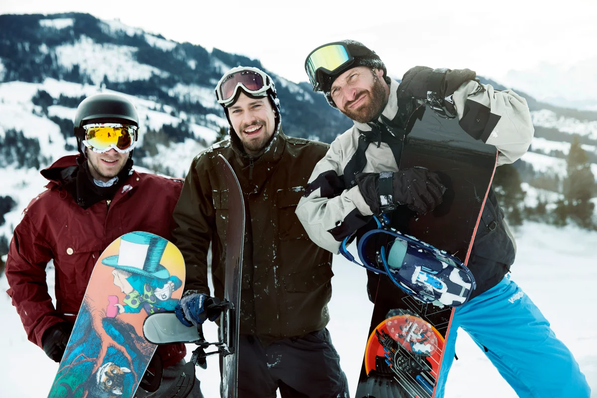 Friends with snowboards on winter holiday