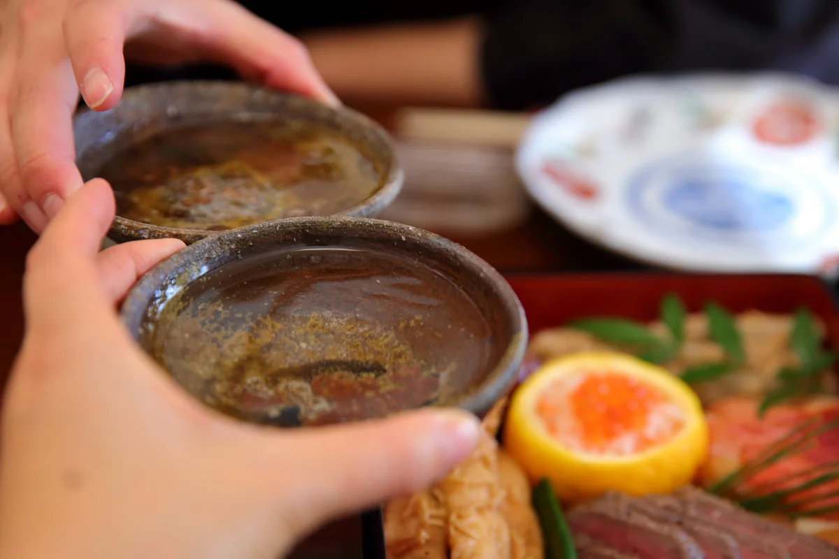 Couple making toast with sake