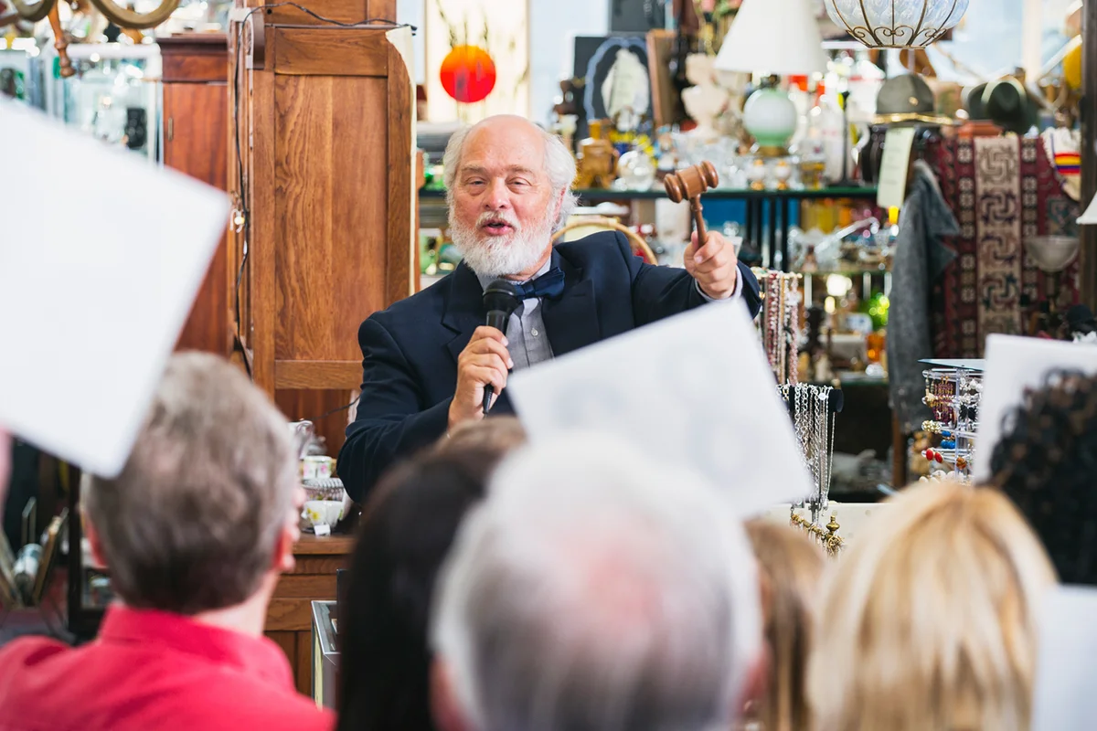 An excited auctioneer at a live auction