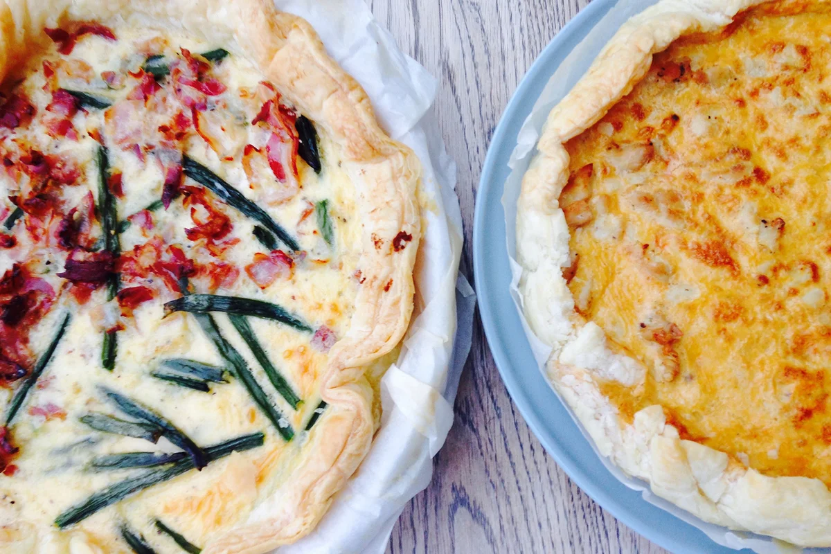 High Angle View Of Quiches Served In Plates On Table