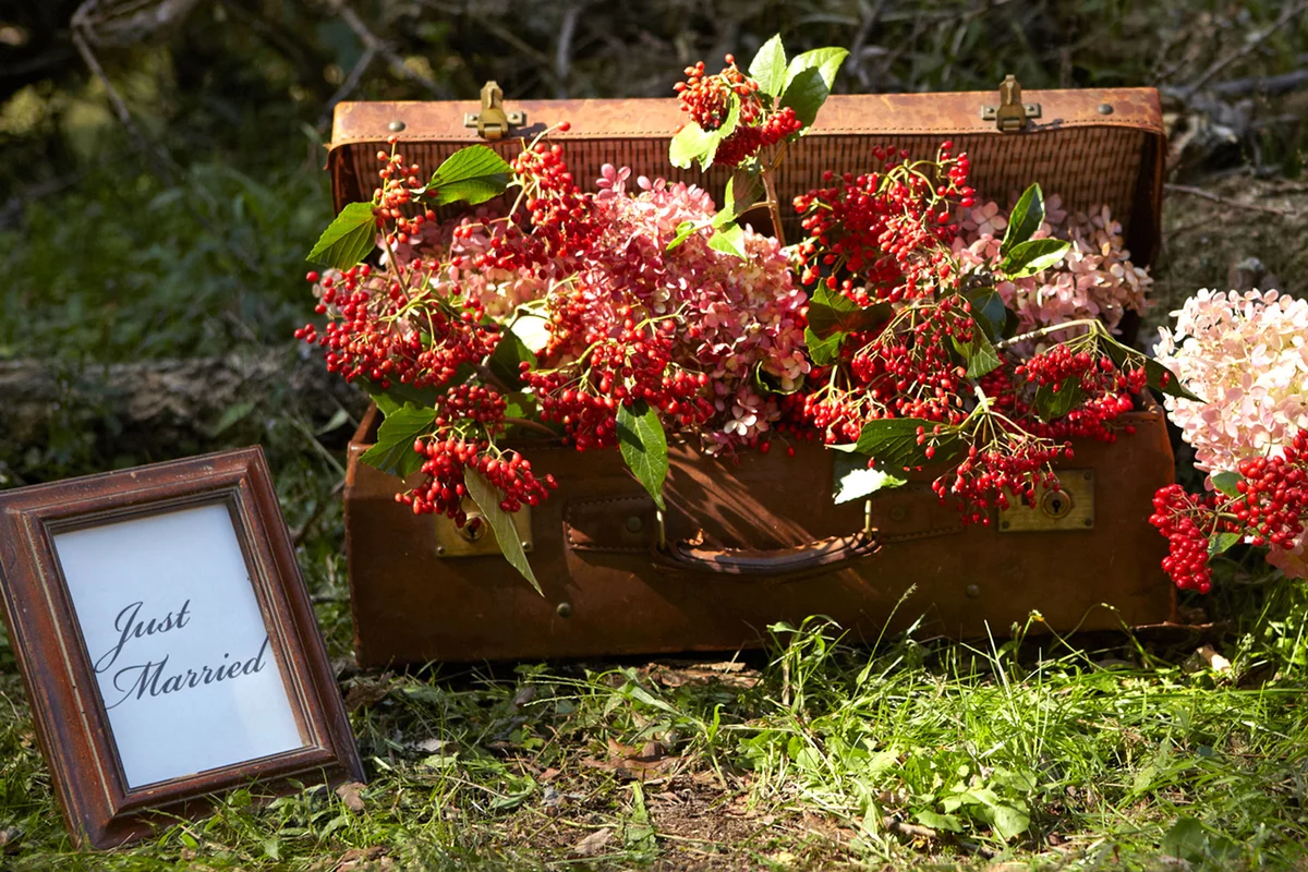 vintage suitcase with flowers wedding decoration