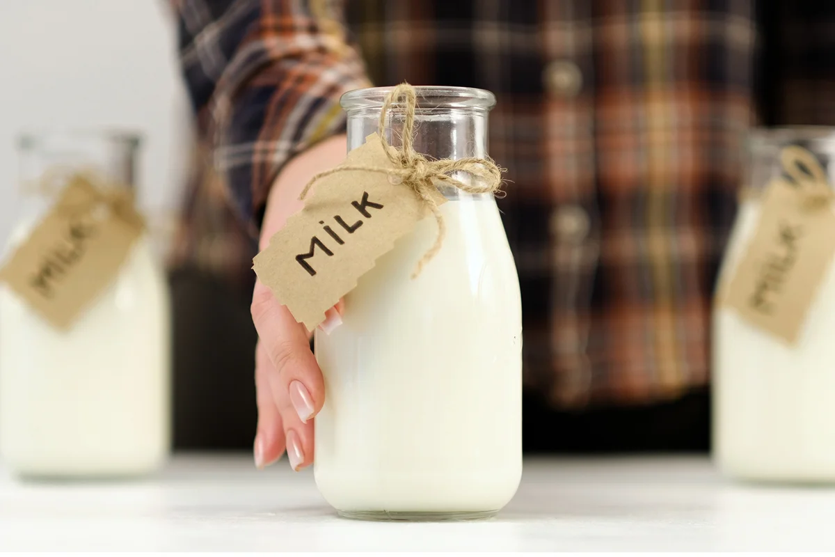 Woman offering milk