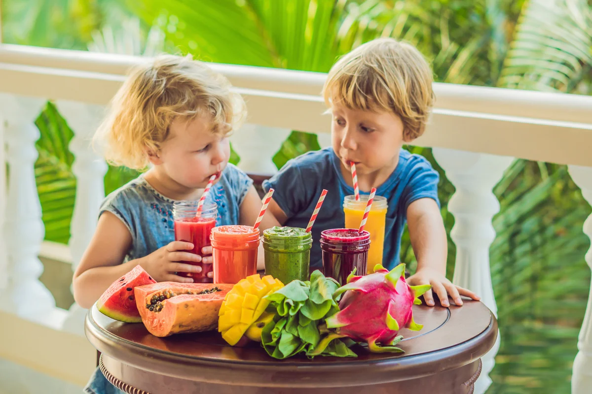 Children drink colorful healthy smoothies