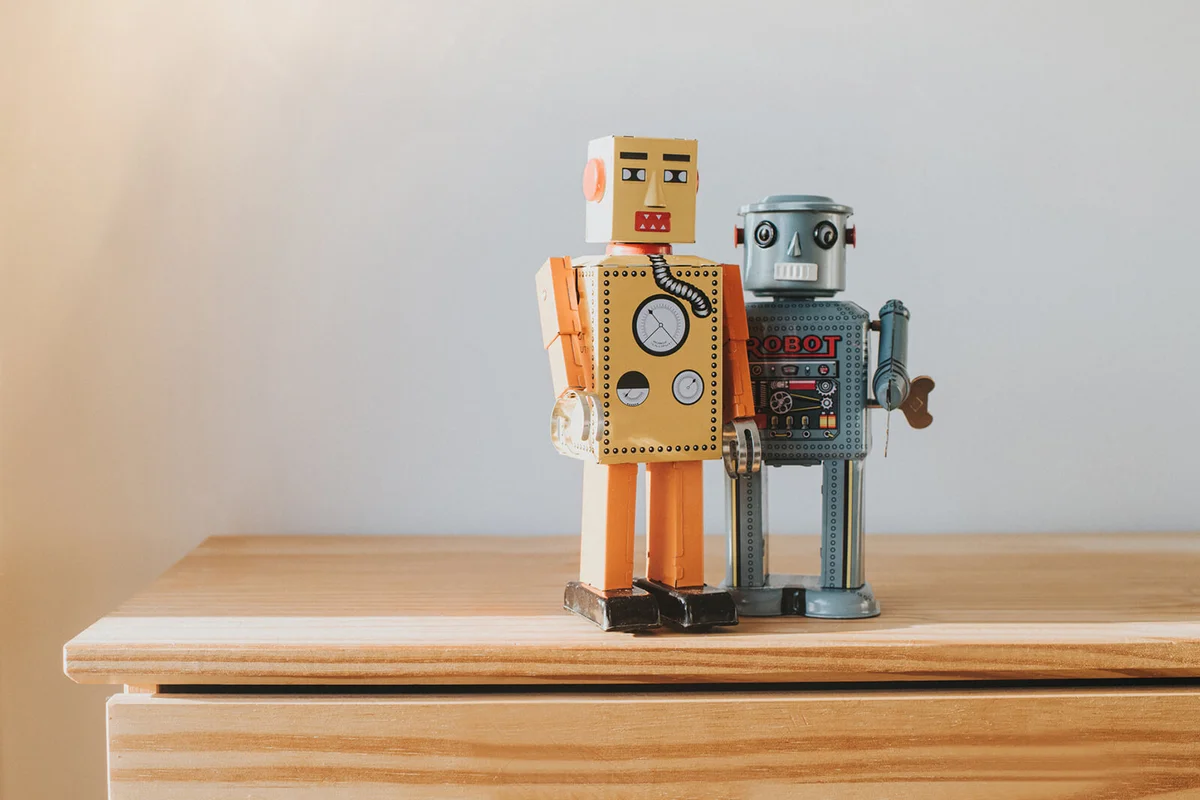 Old robots in a neutral kids room with white walls