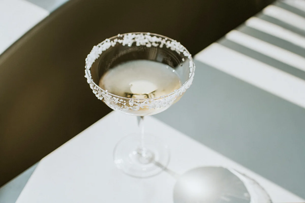 Single Glass of Margarita with Salted Rim on a Shadowy Table
