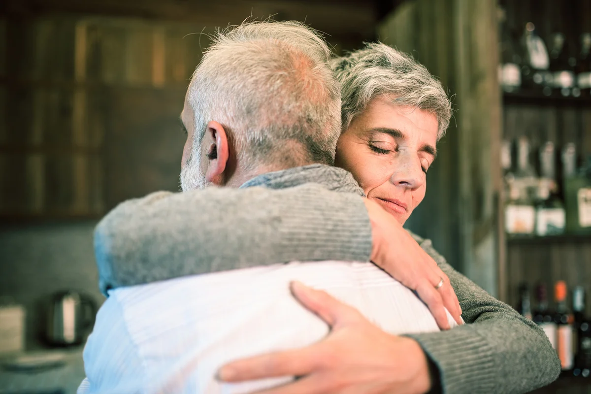 Woman giving support to man
