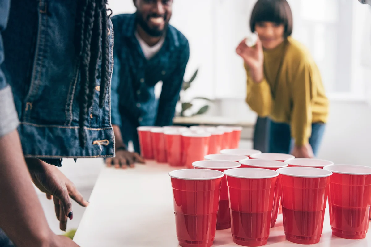 Friends playing Prosecco pong