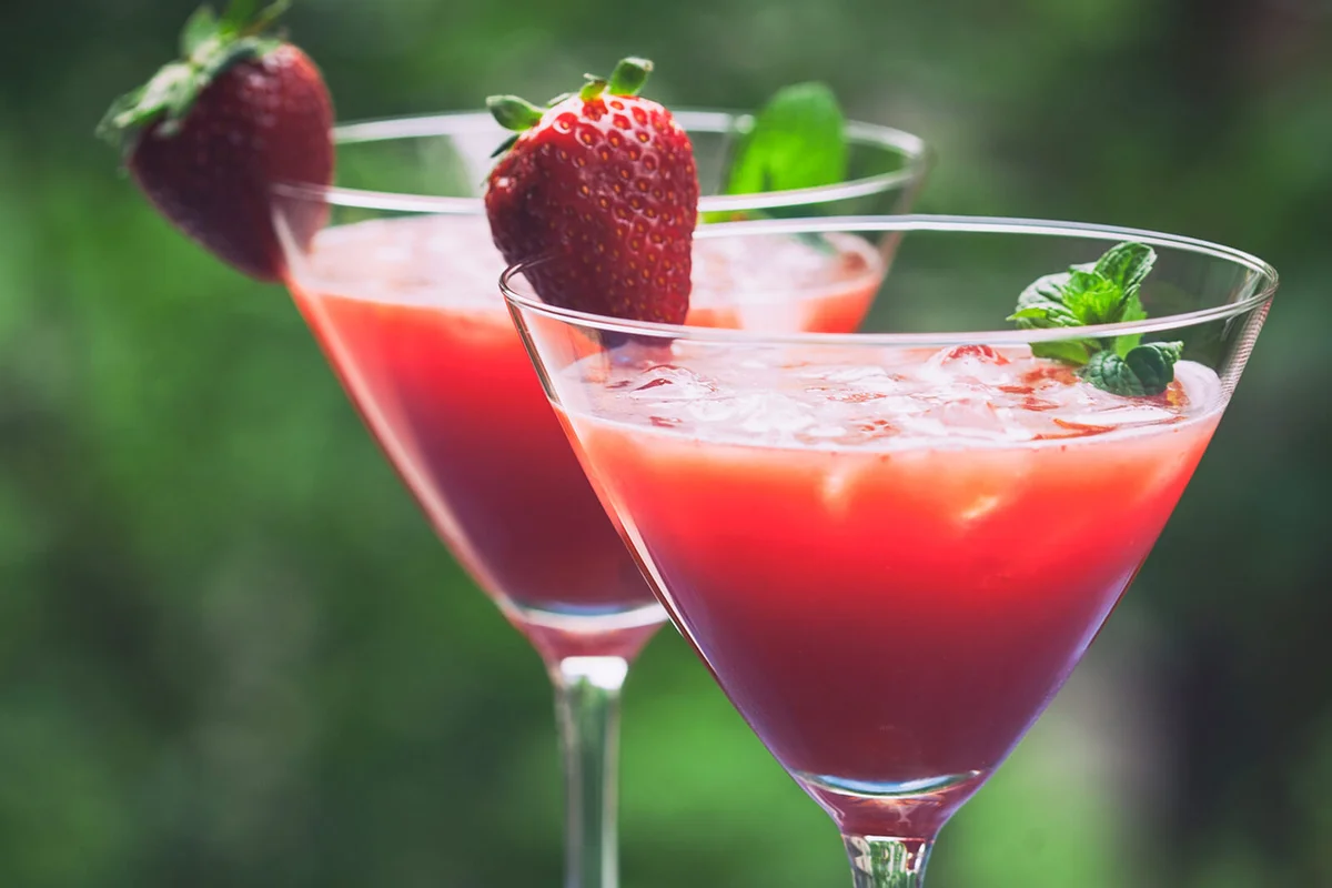 Cold strawberry coctail with a mint leaf