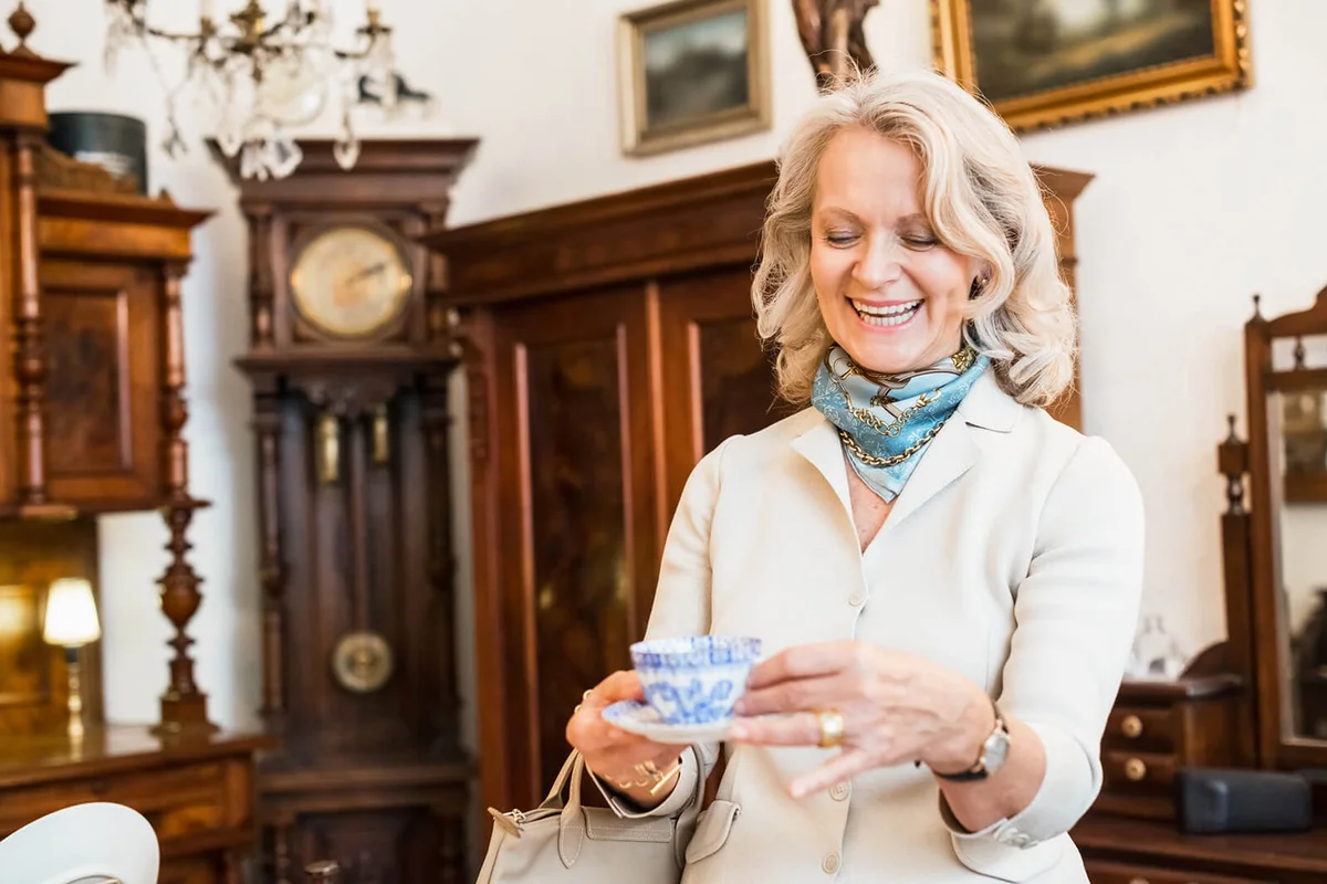 Happy Mature Woman in Antique Store