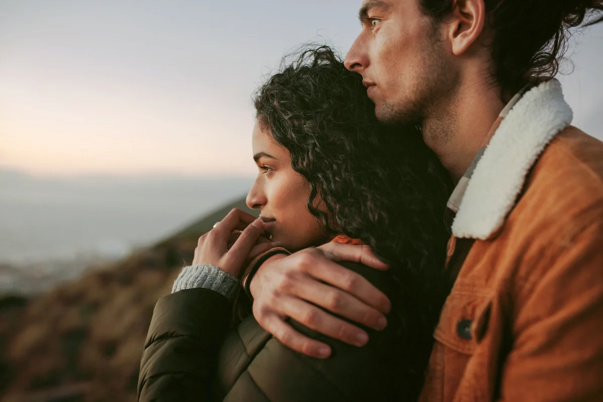 Couple looking at view from mountain