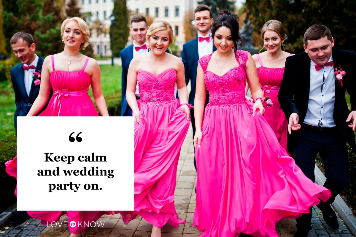 wedding party bridesmaids and groomsmen walking down sidewalk together