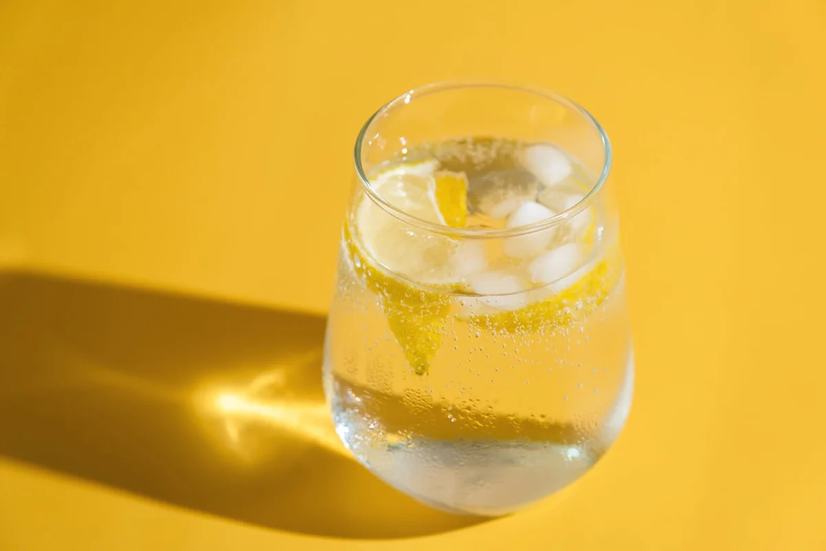 Summer refreshing sparkling drink with ice cube
