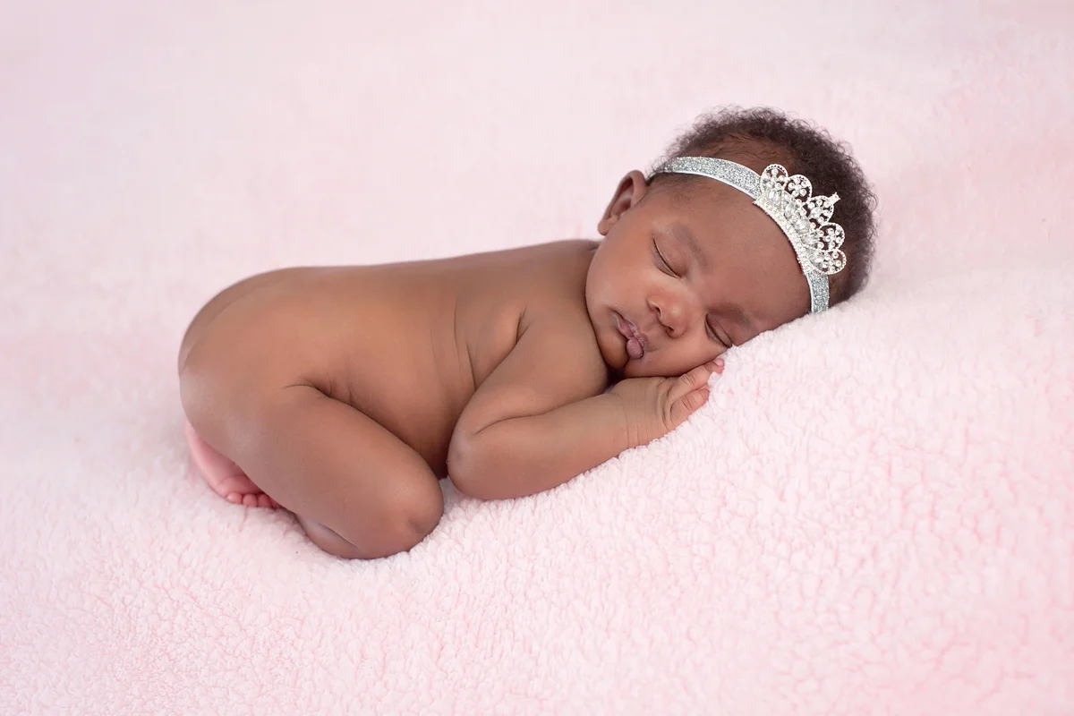 Newborn Baby Girl Wearing a Rhinestone Princess Crown
