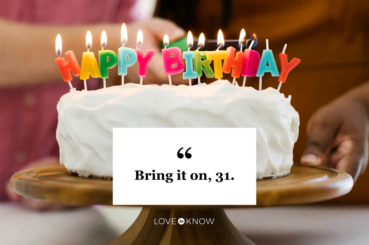 Birthday cake with candles on cake stand
