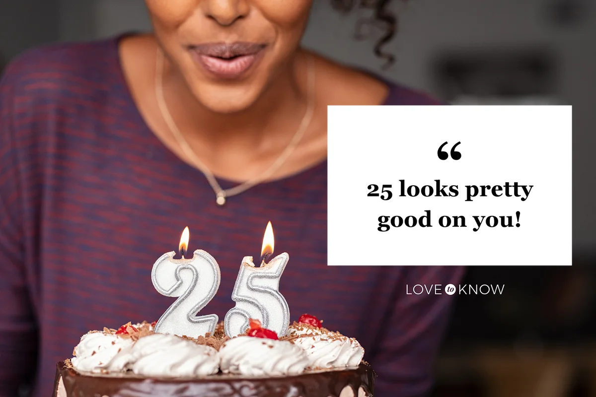 Woman blowing birthday candles on cake