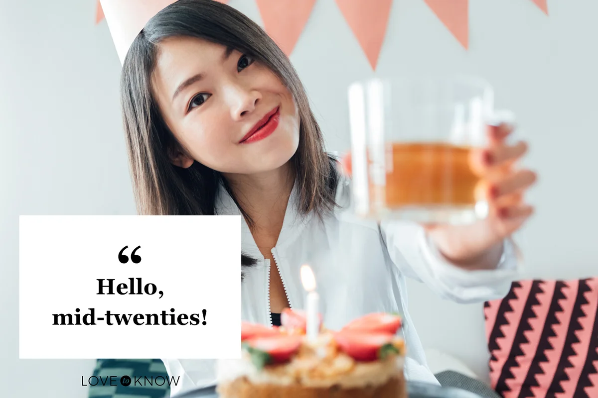 Young woman giving a toast in front of her birthday
