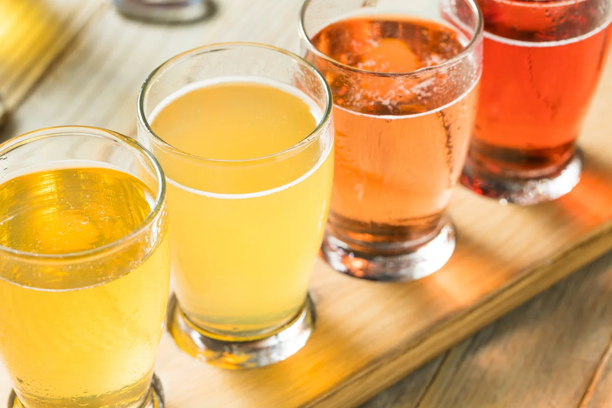 flight of beers and hard cider sample drinks