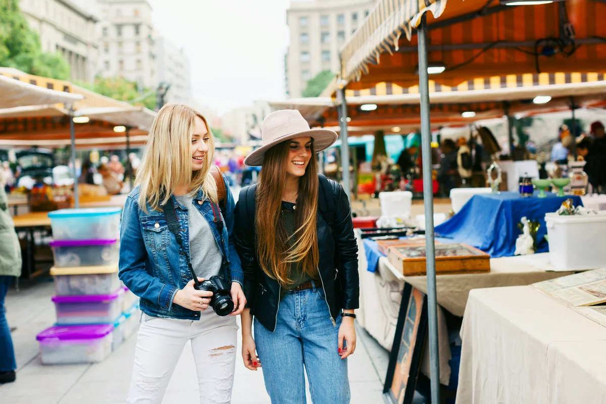 Two young women on flea market