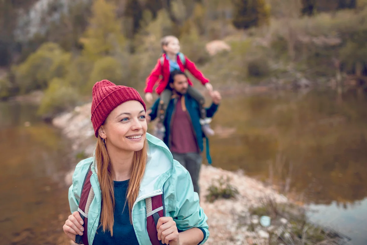 Family Hiking next to a Lake